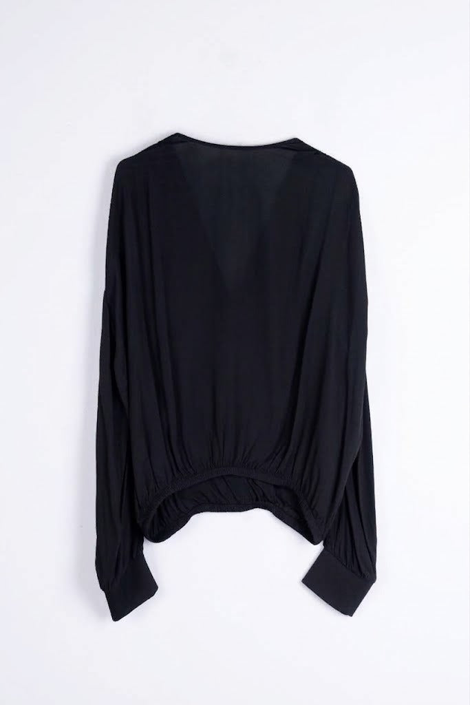 Blusa fluida con fondo elastico